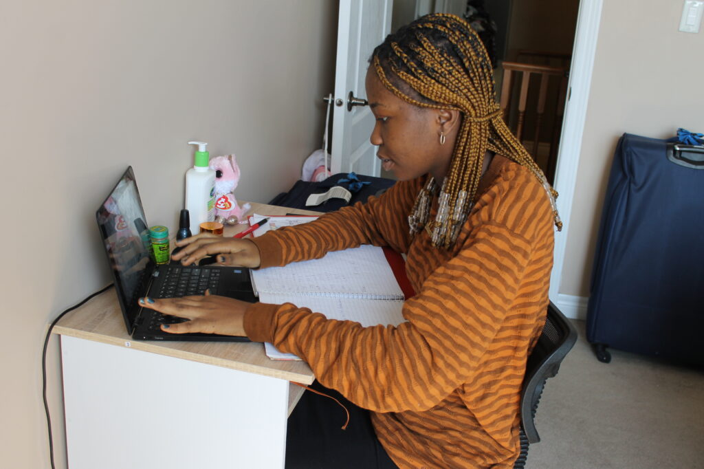 An African student studying/doing school work